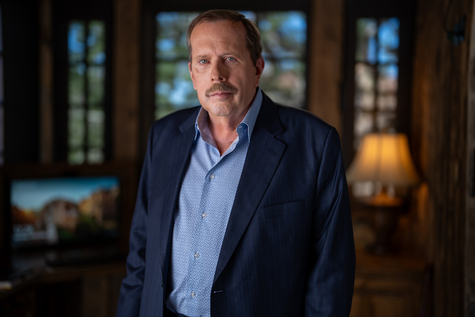 Jim Allsup standing in office in portrait